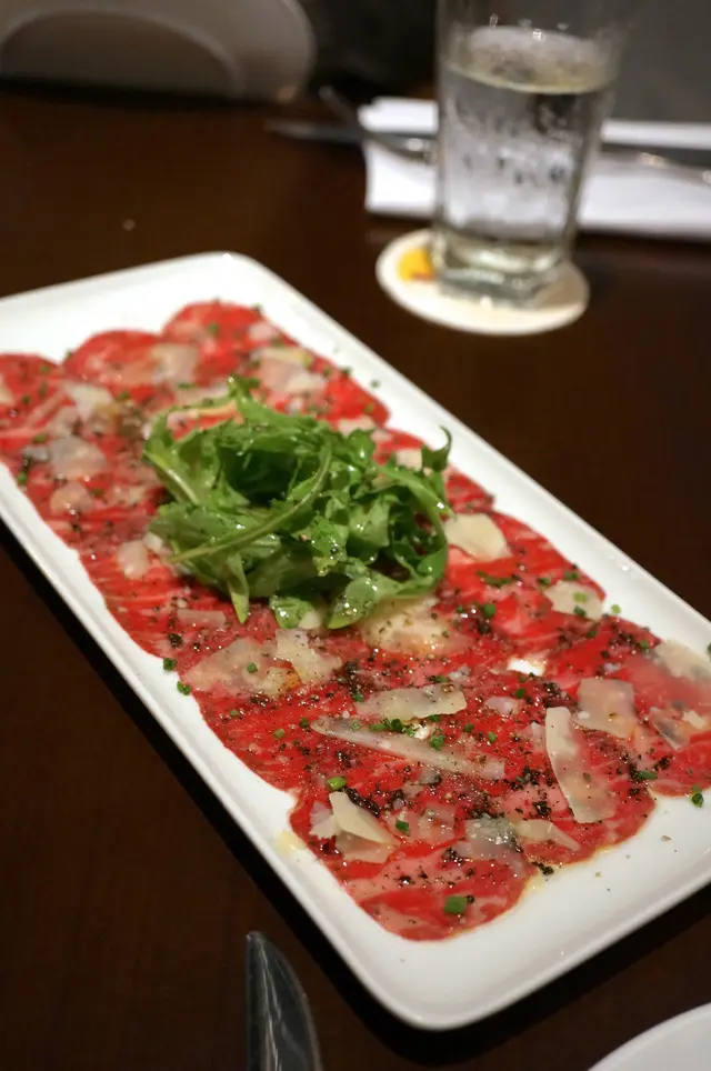 Kobe Beef Carpaccio with Rocket, Parmesan and Black Truffle