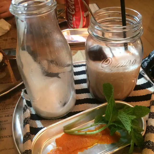 Poured the bottle with warm milk and mixed with the bottle that had chocolate ice cubes