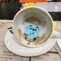 Bear sitting at the bottom of cup