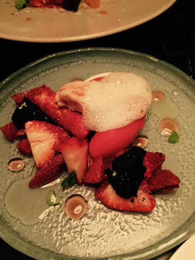 Lime leaf and basil panna cotta, macerated strawberry, black olive