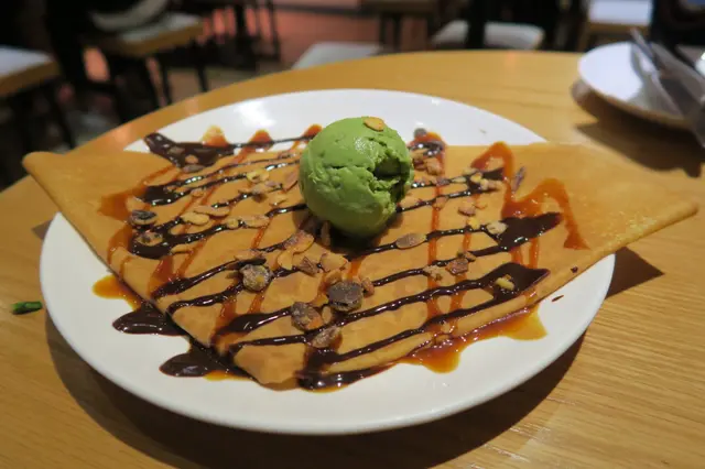 Crepe with Chocolate Sauce, Salted Butter Caramel, Caramelized Almonds and Ice Cream (Green Tea)