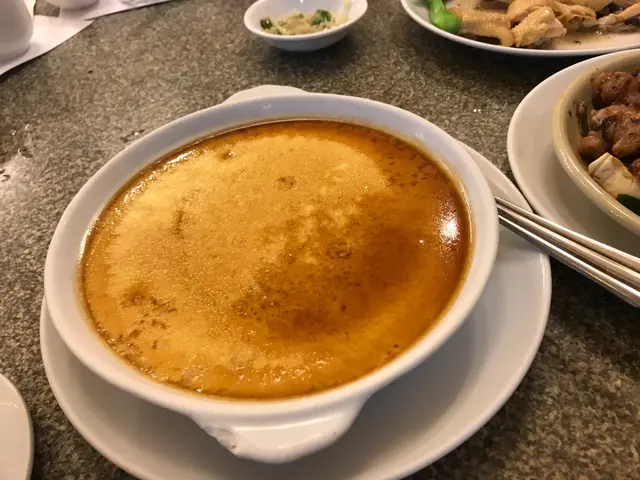 Steamed egg with pork on the bottom. It was like a custard.