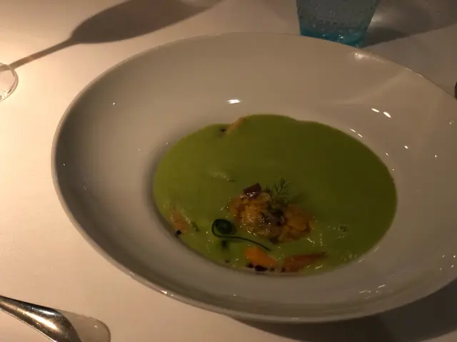 Green courgette velouté, clams and olives