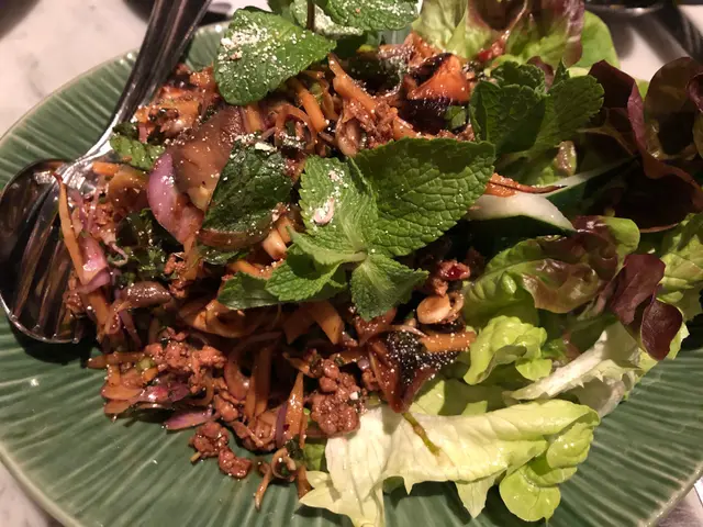 Duck and wild mushroom larb with shredded bamboo, flat leaf coriander, vietnamese mint, lemongrass roasted rice and chiang mai nam prik spices