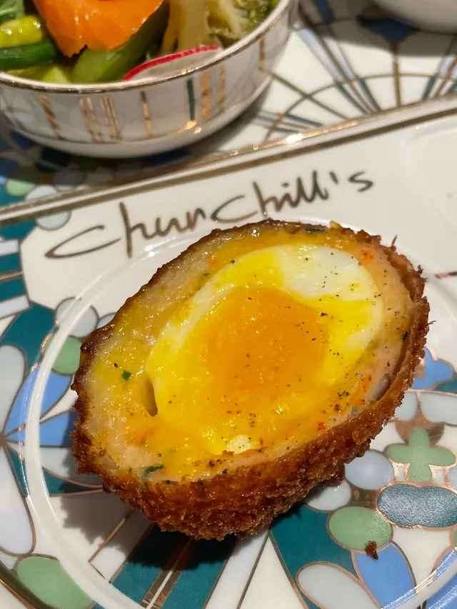 Pork and sage scotch egg with grain mustard