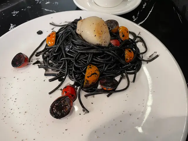 Squid  ink  spaghetti  with  pan-fried  scallops