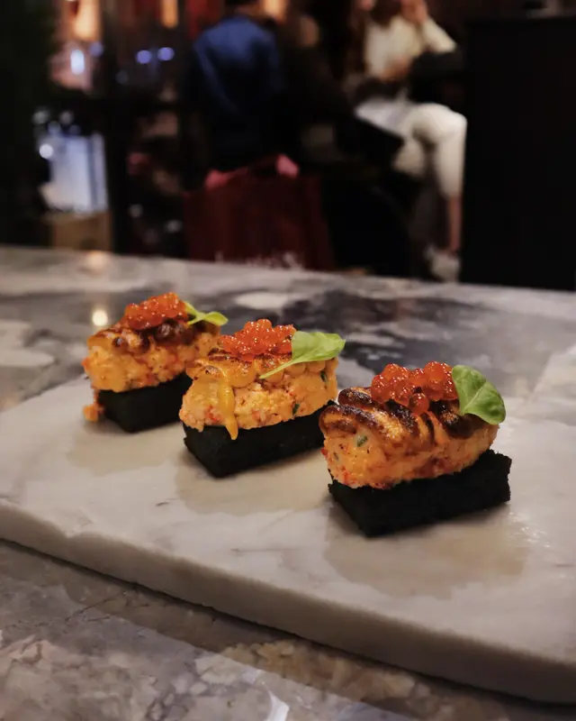 Burnt lobster roll, crab mayo, smoked salmon roe, black brioche