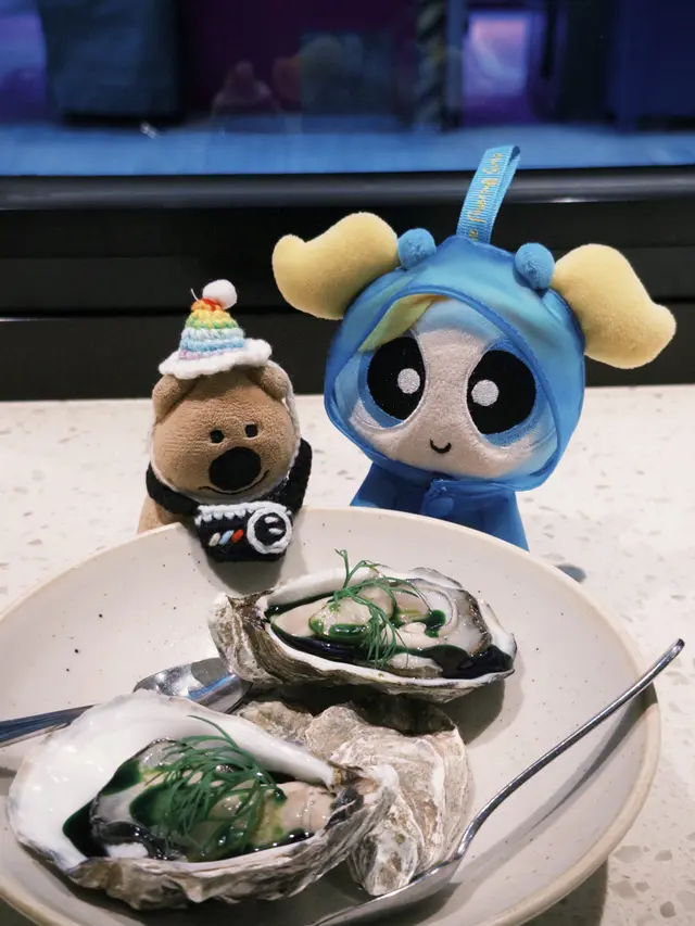 Oyster, pickled cucumber, horseradish, dill