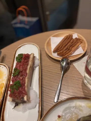 Fassona beef tartare served over grilled bone marrow